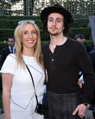 Sam Taylor-Wood and Aaron Johnson pose during the Chanel 2012/13 Cruise Collection at Chateau de Versailles on May 14, 2012 in Versailles, France.