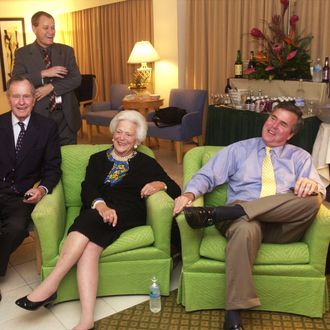 Republican Florida Governor Jeb Bush (R) and his parents, former President George and Barbara Bush, await election returns November 5, 2002 in their Miami, Florida hotel room. Bush is facing Democratic challenger Bill McBride, a Tampa lawyer. Victory for Bush would make him the first Republican governor re-elected in state history. In the background is Bush campaign communications director Todd Harris. (Photo by Joe Burbank/Pool/Getty Images)