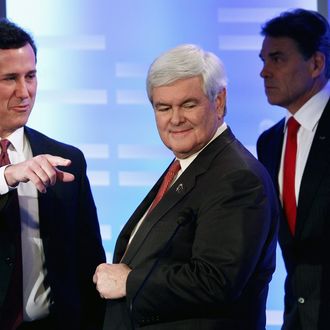 Former U.S. Sen. Rick Santorum, and former Speaker of the House Newt Gingrich during a commercial break in the Republican Presidential Debate at Saint Anselm College January 7, 2012 in Manchester, New Hampshire.