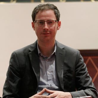 Nate Silver sits on the stairs at a hotel in Chicago on Friday, Nov. 9, 2012. The 34-year-old statistician, unabashed numbers geek, author and creator of the much-read FiveThirtyEight blog at The New York Times, correctly predicted the presidential winner in all 50 states, and almost all the Senate races.