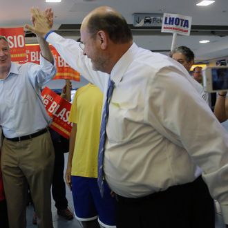 Republican mayoral candidate Joe Lhota, right, greets Democratic mayoral hopeful Bill de Blasio at the Staten Island ferry terminal, Wednesday, Sept. 4, 2013 in New York. Both men were campaigning at the terminal at the same time. 