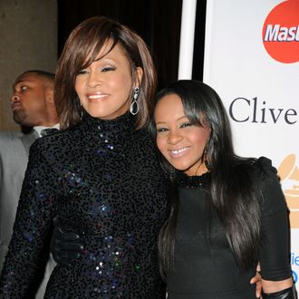 BEVERLY HILLS, CA - FEBRUARY 12: Singer Whitney Houston (L) and Bobbi Kristina Brown arrives at the 2011 Pre-GRAMMY Gala and Salute To Industry Icons Honoring David Geffen at Beverly Hilton on February 12, 2011 in Beverly Hills, California. (Photo by Jason Merritt/Getty Images) *** Local Caption *** Whitney Houston;Bobbi Kristina Brown