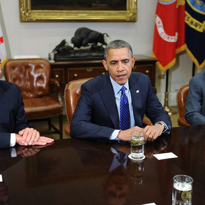 U.S. President Barack Obama (C) speaks as Speaker of the House John Boehner (R-OH) (L) and Senate Majority Leader Harry Reid (D-NV) looks on during a meeting with bipartisan group of congressional leaders in the Roosevelt Room of the White House on November 16, 2012 in Washington, DC. Obama and congressional leaders of both parties are meeting to reportedly discuss deficit reduction before the tax increases and automatic spending cuts go into affect in the new year. 