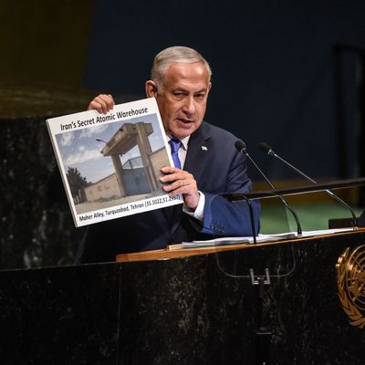 Benjamin Netanyahu, Prime Minister of Israel holds up a placard of a suspected Iranian atomic site while delivering a speech at the United Nations.