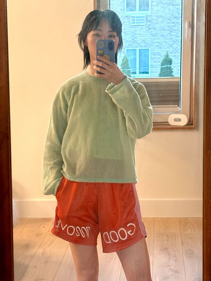 Selfie of the author wearing the Relax Lacrosse Good Move shorts, which are long and orange.
