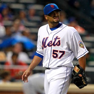 Johan Santana #57 of the New York Mets walks back to the dugout after the final out of the second-inning during the game against the Los Angeles Dodgers at CitiField on July 20, 2012 in the Flushing neighborhood of the Queens borough of New York City.