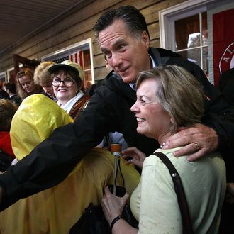 MOBILE, AL - MARCH 12: Republican presidential candidate, former Massachusetts Gov. Mitt Romney greets supporters during a campaign stop at the Whistle Stop cafe March 12, 2012 in Mobile, Alabama. Alabama and Mississippi hold their primaries tomorrow. (Photo by Win McNamee/Getty Images)