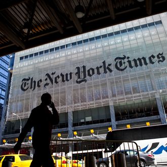 NEW YORK - APRIL 21: A man speaks on his mobile phone across from The New York Times headquarters building April 21, 2011 in New York City. The New York Times profits fell 58 percent in the first quarter of 2011. (Photo by Ramin Talaie/Getty Images)