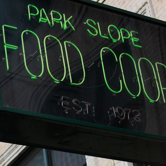 NEW YORK - SEPTEMBER 17: A sign for the Park Slope Food Coop on September 17, 2010 in the Brooklyn borough of New York City. The Park Slope Food Coop, where shoppers must work periodic shifts at the grocery store in order to buy there. The Coop has been named the largest consumer-owned single-store Cooperative by sales in the U.S., tallying $39.4 million during its last fiscal year. (Photo by Chris Hondros/Getty Images)