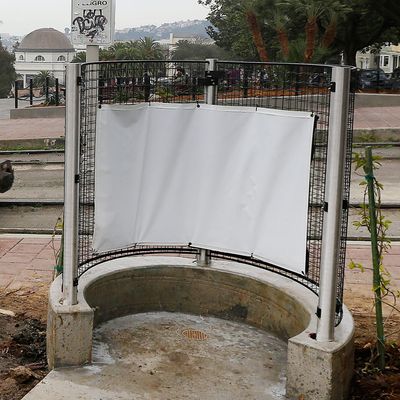 A MUNI streetcar approaches a stop across from Dolores park next to an outdoor urinal in San Francisco, Thursday, Jan. 28, 2016. The popular San Francisco park this week has reopened with renovations and the new public urinal, the latest move to combat public urination in the city. (AP Photo/Jeff Chiu)