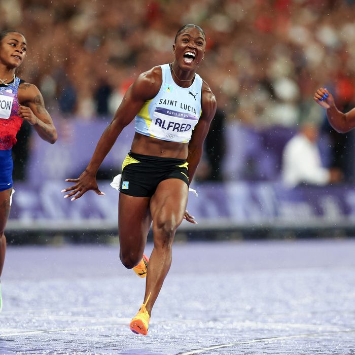 Julien Alfred of Team Saint Lucia (C) celebrates after winning the gold medal in the Women’s 100m Final