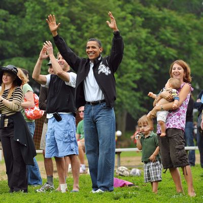 US President Barack Obama (C) celebrates after his daughter Sasha's soccer team scored a goal during a game in Georgetown, May 16, 2009 in Washington, DC. AFP PHOTO/Mandel NGAN (Photo credit should read MANDEL NGAN/AFP/Getty Images)