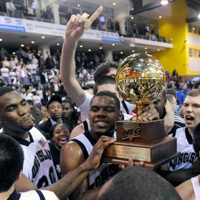 Long Island players celebrate after defeating Robert Morris 85-82 in overtime to win the Northeast Conference Championship.