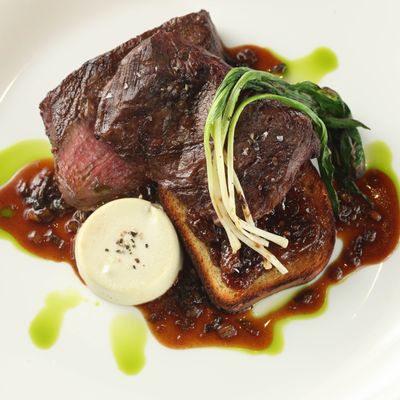 Beautique's steak arrives with bone-marrow flan, grilled ramps, <i>and</i> ramp jus.