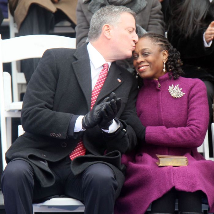 NEW YORK, NY - JANUARY 01: Bill De Blasio and his wife Chirlane De Blasio at the inaguration ceremony on the steps of City Hall making him NYC's 109th mayor on January 1, 2014 in New York City. (Photo by Steve Sands/WireImage)