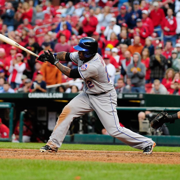 Willie Harris #22 of the New York Mets hits a game winning two run single against the St. Louis Cardinals at Busch Stadium on September 22, 2011 in St. Louis, Missouri.