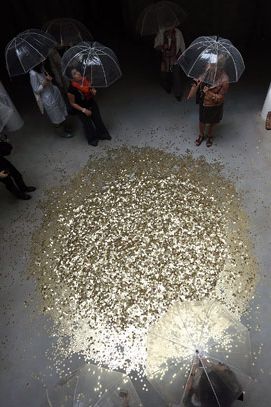 In the Russian Pavilion, Vadim Zakharov restages the myth of Zeus’s seduction of Danae, but in the form of a shower of gold coins; access to the lower floor is restricted to women, who are given transparent umbrellas as they enter and are invited to pick up the coins and place them in a bucket that is periodically hoisted up to replenish the supply of falling currency.