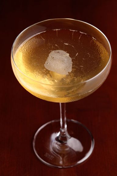 Tea Rose Champagne Cocktail with Moet 'Imperial' Champagne and lemon-infused tea-rose macerate.