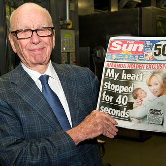 BROXBOURNE, UNITED KINGDOM - FEBRUARY 25: (EDITORS NOTE: THIS IMAGE IS FREE FOR USE UNTIL MARCH 3 2012) In this handout photograph provided by News International, Rupert Murdoch, Chairman and CEO of News Corporation, reviews the first edition of The Sun On Sunday as it comes off the presses on February 25, 2012 in Broxbourne, England. Around 3 million copies of 'The Sun On Sunday', the first ever Sunday edition of News Corporation's daily newspaper 'The Sun', are due to go on sale on Sunday February 26, 2012. (Picture Arthur Edwards/News International via etty Images)