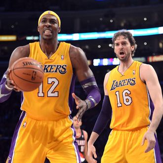 Pau Gasol #16 and Dwight Howard #12 of the Los Angeles Lakers react to a foul call during the game against the Portland Trail Blazers at Staples Center on December 28, 2012 in Los Angeles, California. The Lakers won 104-87.