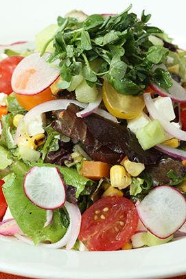Field greens, tomato, avocado, feta, cucumber, roasted corn radish, red onion, and olive vinaigrette.