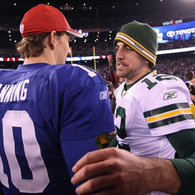 EAST RUTHERFORD, NJ - DECEMBER 04: (L-R) Eli Manning #10 of the New York Giants congratulates Aaron Rodgers #12 of the Green Bay Packers after the Packers won 38-35 at MetLife Stadium on December 4, 2011 in East Rutherford, New Jersey. 