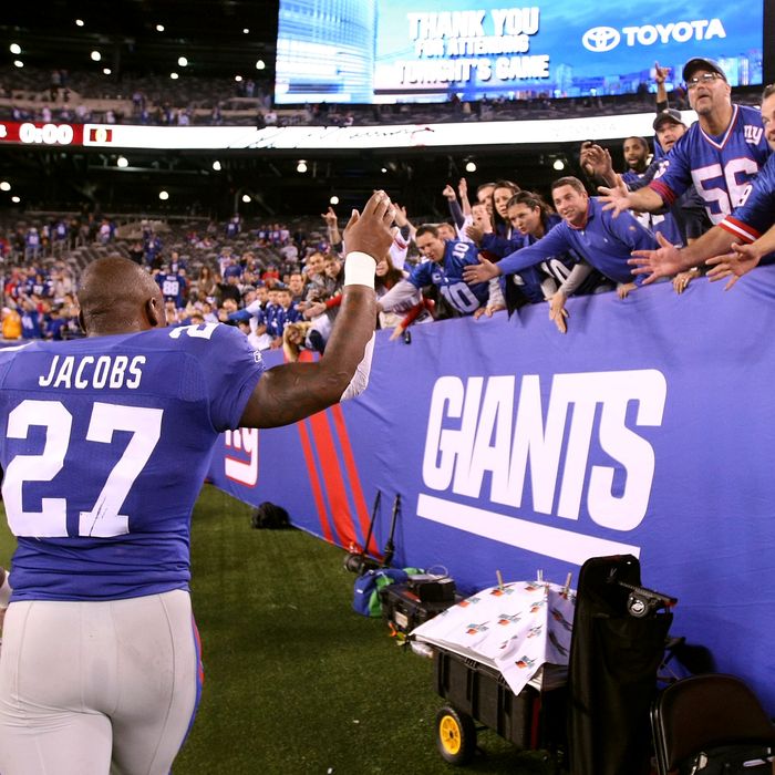 EAST RUTHERFORD, NJ - SEPTEMBER 19: Brandon Jacobs #27 of the New York Giants celebrates with fans after the Giants won 28-16 against the St. Louis Rams at MetLife Stadium on September 19, 2011 in East Rutherford, New Jersey. (Photo by Al Bello/Getty Images)