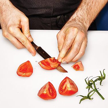 2. Scoop out seeds and core the tomato.