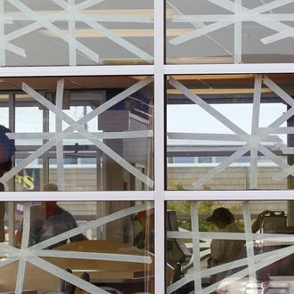 OCEAN CITY, MD - AUGUST 26: A worker tapes up the windows of a McDonald's restaurant in preperation of high winds on August 26, 2011 in Ocean City, Maryland. Ocean City Mayor Rick Meehan has ordered a mandatory evacuation for thousands of residents and visitors to leave the oceanfront community, and Maryland Gov. Martin O'Malley has declared a state of emergency as Hurricane Irene approaches. (Photo by Mark Wilson/Getty Images)