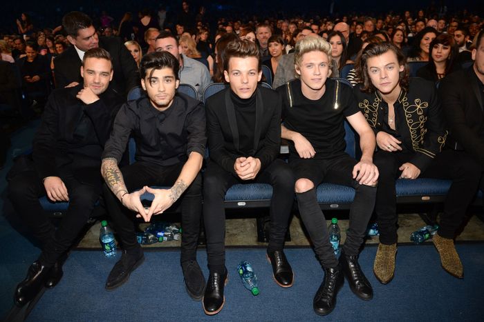 Louis Tomlinson says One Direction's first album was 's**t