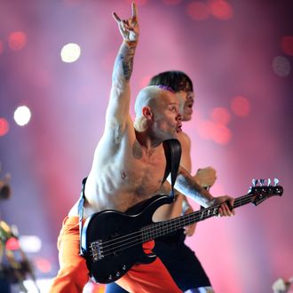 EAST RUTHERFORD, NJ - FEBRUARY 02: Flea and Anthony Kiedis of the Red Hot Chili Peppers performs during the Pepsi Super Bowl XLVIII Halftime Show at MetLife Stadium on February 2, 2014 in East Rutherford, New Jersey. (Photo by Rob Carr/Getty Images)