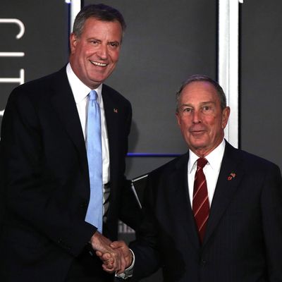 Democratic nominee for New York Mayor Bill de Blasio (L) appears on stage with current New York Mayor Michael Bloomberg at 