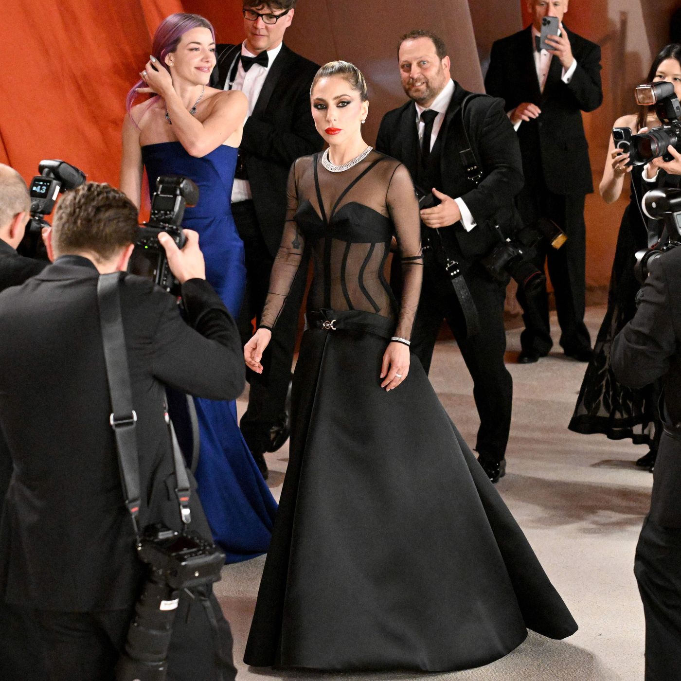 Lady Gaga Assists Fallen Photographer at 2023 Oscars Lady Gaga Assists Fallen Photographer at 2023 Oscars