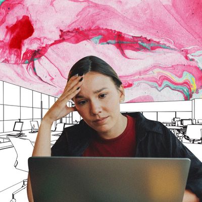 A woman resting her head on her right hand looks at a laptop screen with concern.