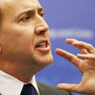 US actor and Goodwill Ambassador for Global Justice Nicolas Cage gestures as he speaks at the fifth session of Parties to the United Nations Convention against Transnational Organized Crime on October 21, 2010 in Vienna. AFP PHOTO/DIETER NAGL (Photo credit should read DIETER NAGL/AFP/Getty Images)