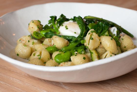 Green-garlic lumache with duck egg, asparagus, fiddleheads, and fava beans.