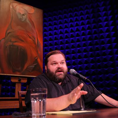 Mike Daisey in All the Faces of the Moon with the oil painting from Chapter 13, That Hideous Strength by artist Larissa Tokmakova, directed by Jean-Michele Gregory, running in Joe's Pub at The Public Theater through October 3. 