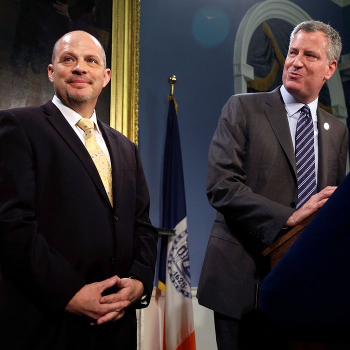 As New York City Mayor Bill de Blasio, right, and President of the United Federation of Teachers Michael Mulgrew participate in a news conference at City Hall in New York, Thursday, May 1, 2014. New York City and its largest teachers union struck a deal on a new contract Thursday, ending a nearly five-year labor dispute and potentially setting a template for negotiations with the city's other unions. (AP Photo/Seth Wenig)