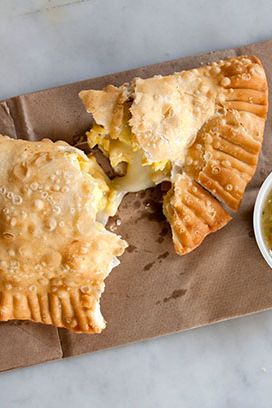 70 N. 6th St., nr. Wythe Ave., Williamsburg; 718-782-3334
Cubana Social's takeout window mostly served coffee and other drinks, but the one food item — empanadas — is worth the five-minute wait. Choose from grass-fed beef picadillo, chicken, cheese and organic egg, our our favorite, chorizo and potato. The flaky pastries arrive piping hot, with a side of green salsa.