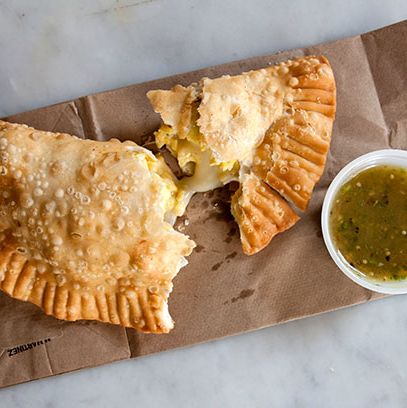 70 N. 6th St., nr. Wythe Ave., Williamsburg; 718-782-3334
Cubana Social's takeout window mostly served coffee and other drinks, but the one food item — empanadas — is worth the five-minute wait. Choose from grass-fed beef picadillo, chicken, cheese and organic egg, our our favorite, chorizo and potato. The flaky pastries arrive piping hot, with a side of green salsa.