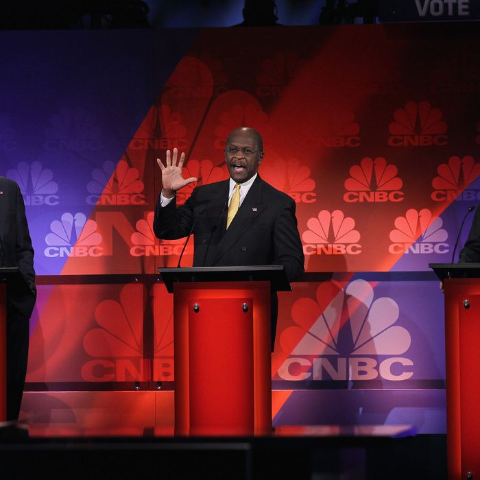 ROCHESTER, MI - NOVEMBER 09: Republican presidential candidates (L to R) former Massachusetts Governor Mitt Romney, businessman Herman Cain, and Texas Governor Rick Perry participate in a debate hosted by CNBC and the Michigan Republican Party at Oakland University on November 9, 2011 in Rochester, Michigan. The debate is the first meeting of the eight GOP presidential hopefuls since allegations of sexual impropriety have surfaced against front-runner Herman Cain. (Photo by Scott Olson/Getty Images)