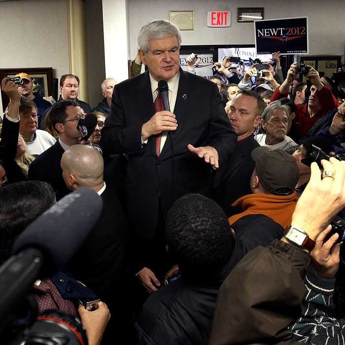 GREENVILLE, SC - JANUARY 21: Republican presidential candidate, former Speaker of the House Newt Gingrich speaks to a packed house while standing on an ice cooler at Tommy's Country Ham House January 21, 2012 in Greenville, South Carolina. Republican presidential candidate, former Massachusetts Gov. Mitt Romney also campaigned at Tommy's Country Ham House just before Gingrich. South Carolina holds its pivotal presidential primary today. (Photo by Win McNamee/Getty Images)