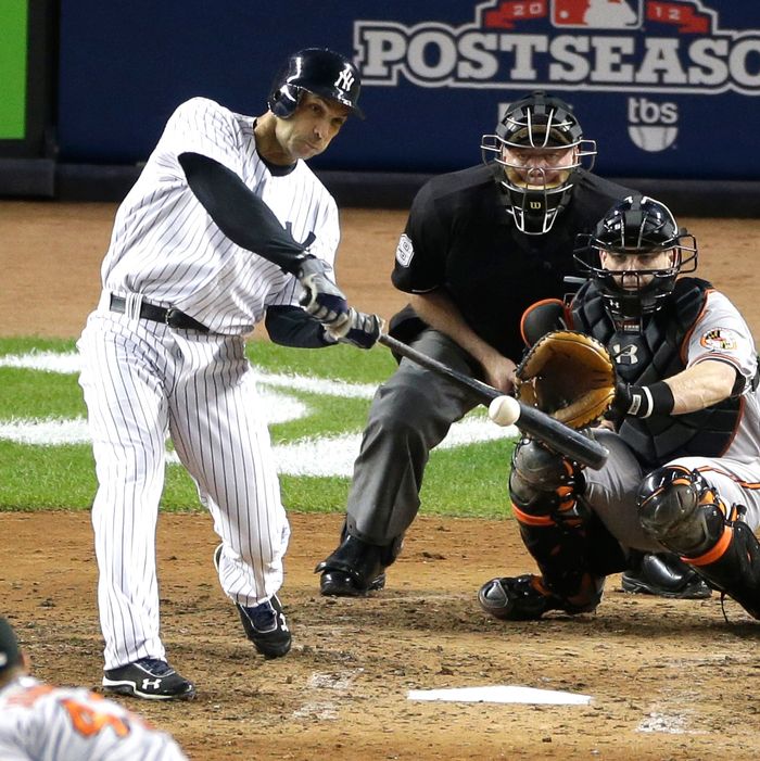New York Yankees' Raul Ibanez hits a solo home run to tie the game in the ninth inning in Game 3 of the American League division baseball series against the Baltimore Orioles on Wednesday, Oct. 10, 2012, in New York. The Orioles catcher is Matt Wieters and the umpire is Brian Gorman.