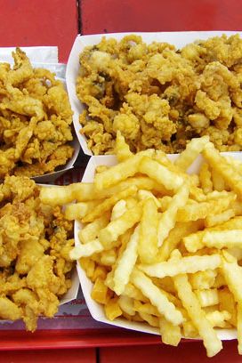 "Fried Belly Clams from Flo's Clam Shack! It's a real seaside shanty that's best known for it's fried belly clams, not to be confused with clam strips. You take them fresh from the fryer and chow down right there on the beach. I'm allergic to shellfish but I dont even care, they're that incredible."