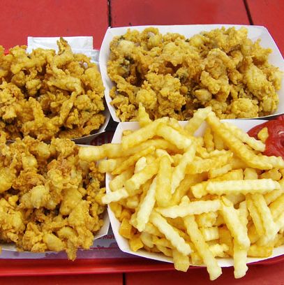 "Fried Belly Clams from Flo's Clam Shack! It's a real seaside shanty that's best known for it's fried belly clams, not to be confused with clam strips. You take them fresh from the fryer and chow down right there on the beach. I'm allergic to shellfish but I dont even care, they're that incredible."