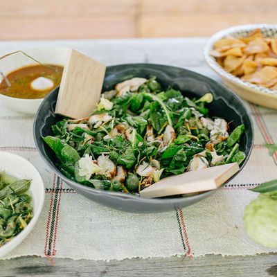 Salad with roast chicken, arugula, and citrus-marinated olives.