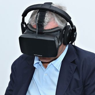 Robert De Niro uses virtual reality goggles on April 22, 2014 in New York City. 