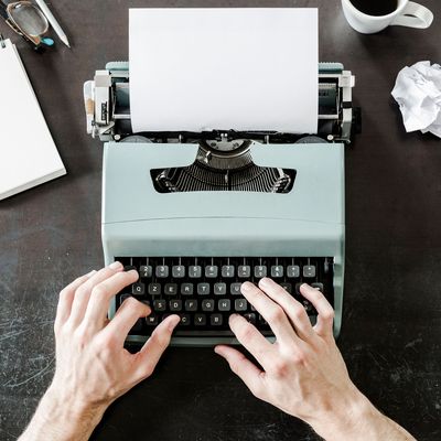 A man on a typewriter.
