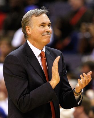 Head coach Mike D'Antoni of the New York Knicks applaudes his team from the sidelines during the second half against the Washington Wizards at Verizon Center on February 8, 2012 in Washington, DC. 