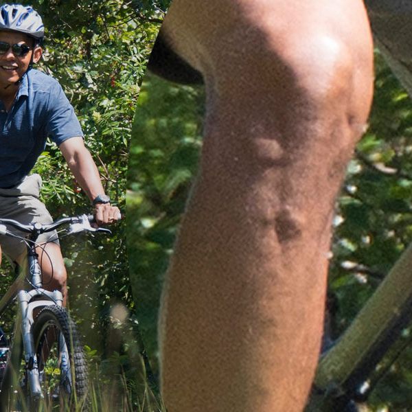 US President Barack Obama bike rides through the Manuel F. Correllus State Forest in West Tisbury, Massachusetts, August 16, 2013, during the Obama family vacation to Martha's Vineyard. AFP PHOTO/Jim WATSON (Photo credit should read JIM WATSON/AFP/Getty Images)